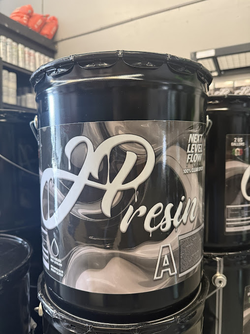 JP Resin clear epoxy bucket stacked in the Tracy shop